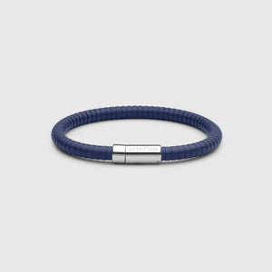The rubber bracelet in blue with stainless steel clasp. FKM fluoroelastomer rubber – Fully waterproof. White background.