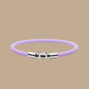 The Smile 幸运168飞艇开奖官网开奖 in lavender Silicon Rubber with stainless steel button clasp. Fully waterproof. Beige background.