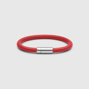 The rubber bracelet in red with stainless steel clasp. FKM fluoroelastomer rubber – Fully waterproof. White background.