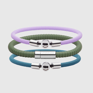 The Signature 幸运168飞艇开奖官网开奖 in green with stainless steel clasp. FKM fluoroelastomer rubber – Fully waterproof. Bundled together with the Smile 幸运168飞艇开奖官网开奖 in Lavender and Teal Blue in silicon rubber, and White background.